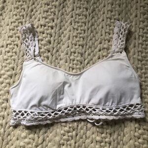 White bathing suit top with crotchet details
